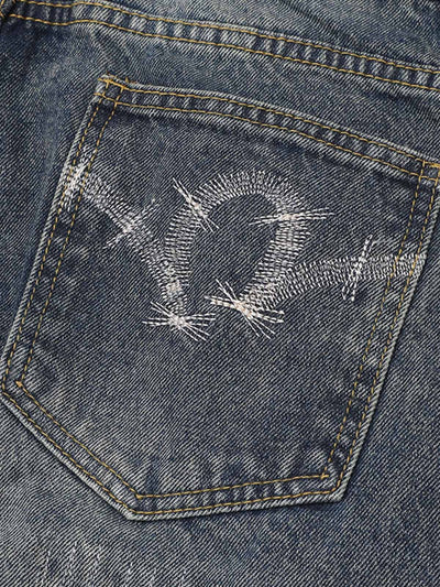 Distressed Camouflage Patchwork Jeans
